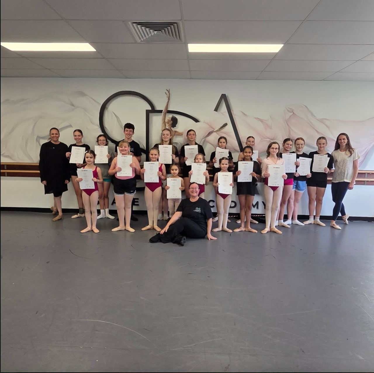 Stage Door Academy ballet students with exam results.