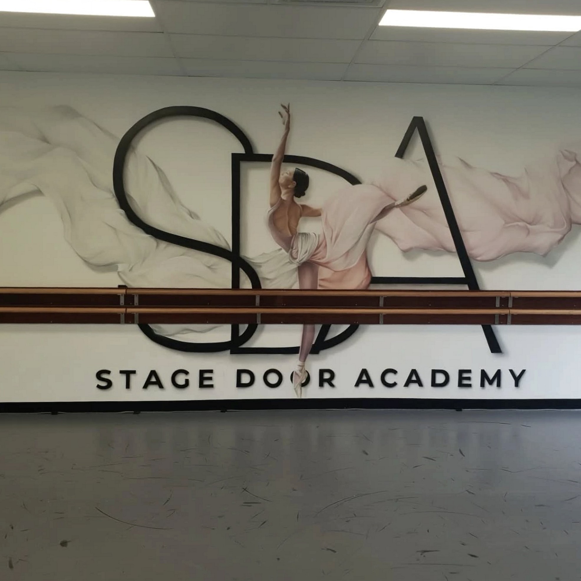 Stage Door Academy studio wall mural and ballet barre