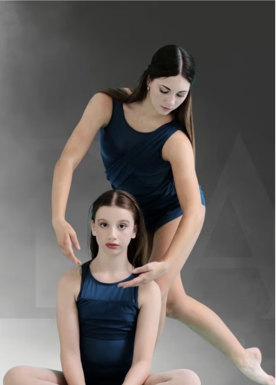 Pre College dancers training in blue dancewear.