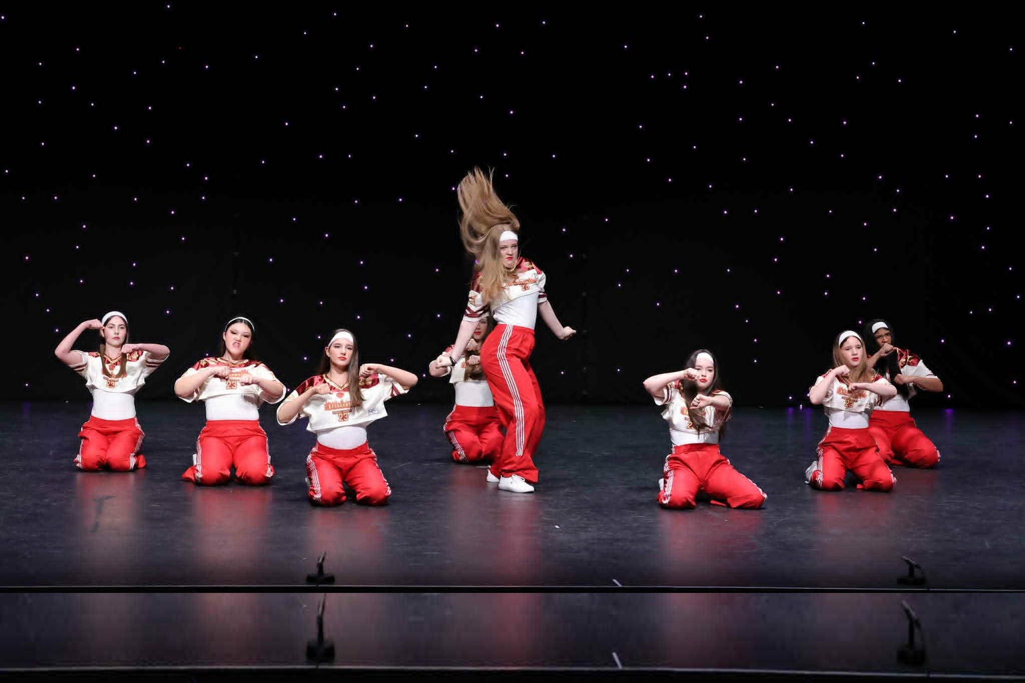 Stage Door Academy hip hop students performing on stage.