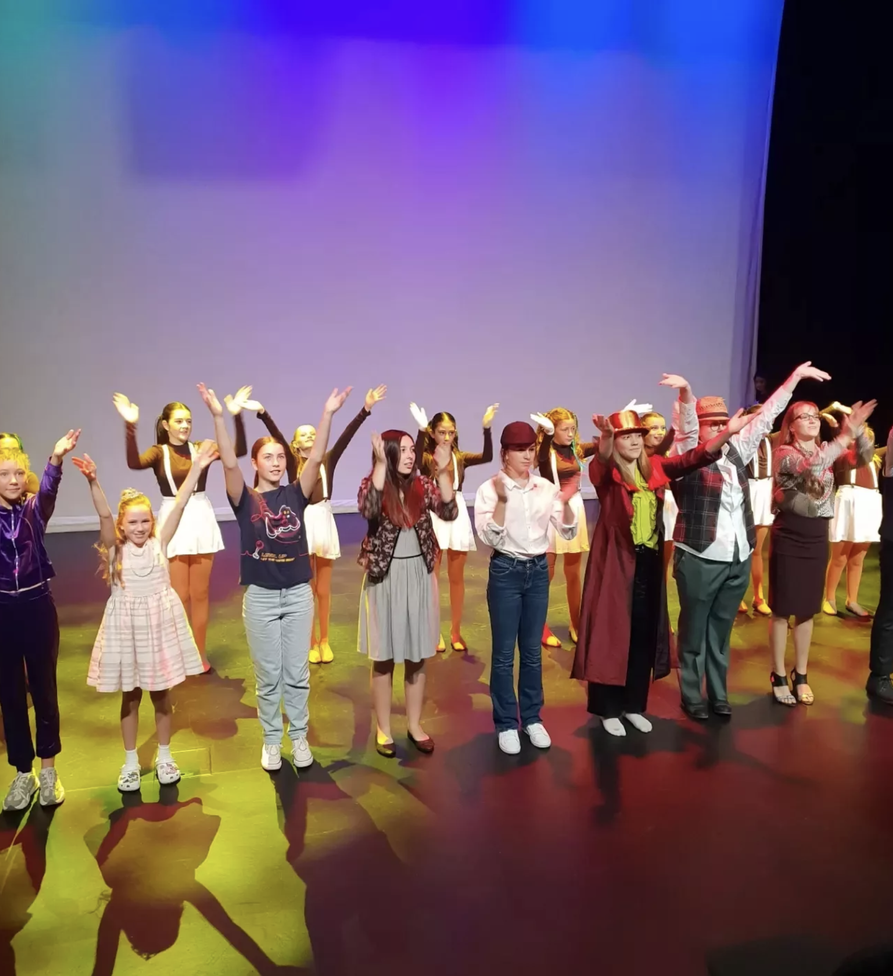 Stage Door Academy musical theatre students performing on stage.