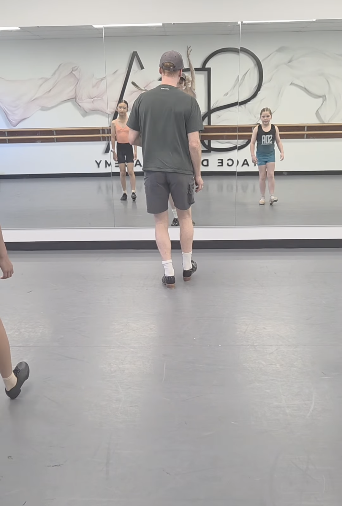 Stage Door Academy tap students learning footwork in the studio.